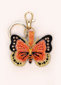Chaveiro borboleta com miçangas coloridas e fecho metálico dourado
