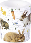 vela decorativa com coelhos, cenoura, flores e texto manuscrito