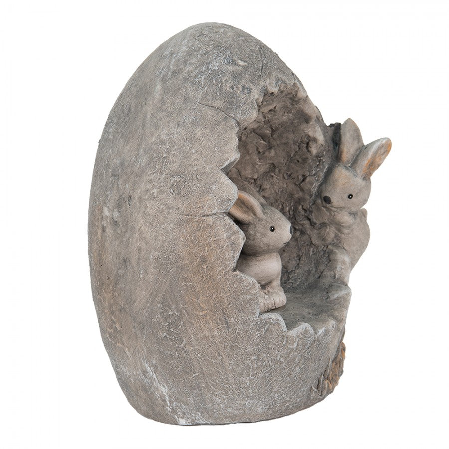 Escultura ovo cinzento com dois coelhos dentro