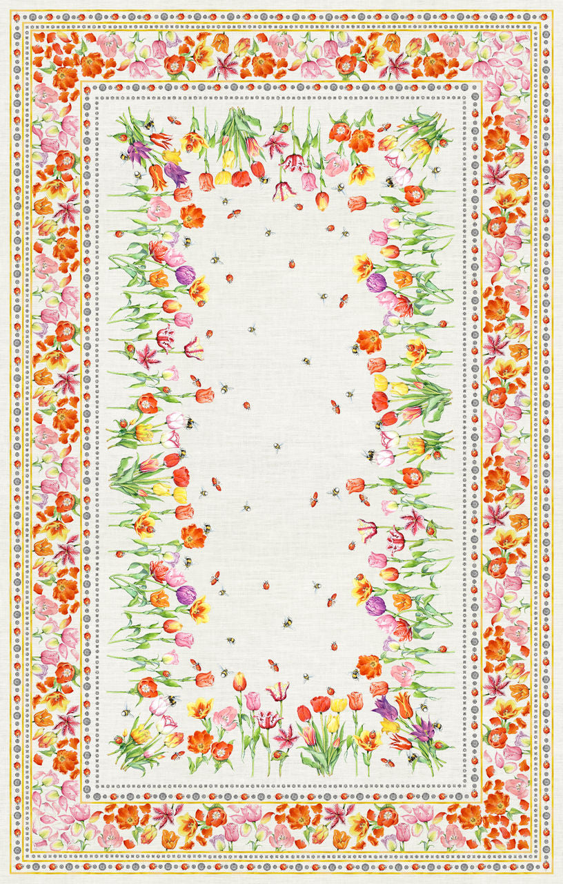 Toalha de mesa branca com padrão floral colorido e pequenas abelhas no centro.