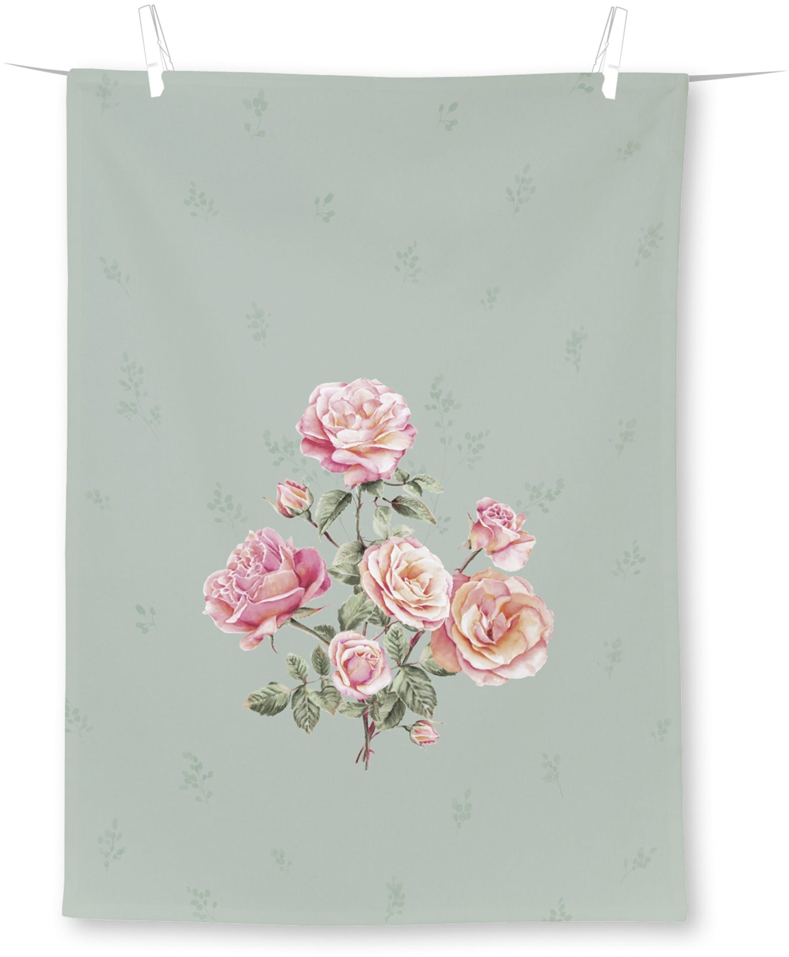 Toalha ou tecido verde claro com padrão de folhas e rosas rosas pendurado.