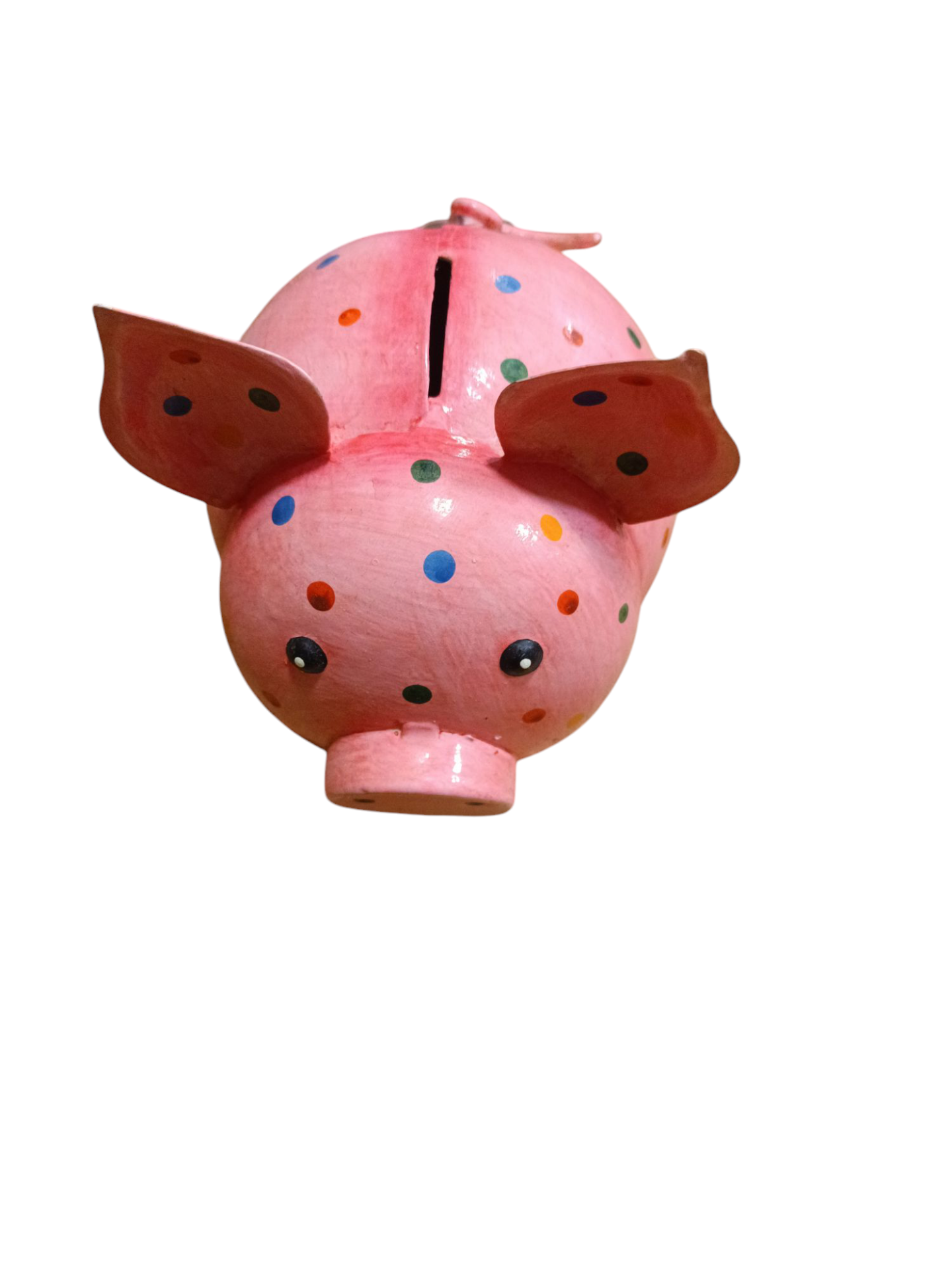 Mealheiro porquinho cor-de-rosa com pontos coloridos e orelhas salientes visto de cima