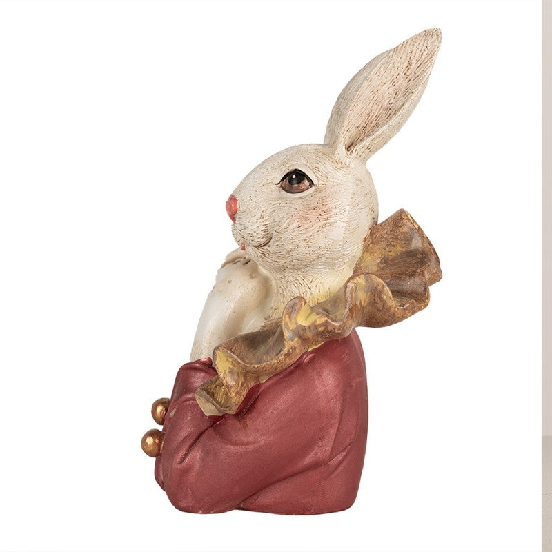 Escultura decorativa de coelho vestido em roupa vermelha e dourada