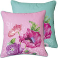 Almofadas quadradas com padrão floral em rosa e azul turquesa