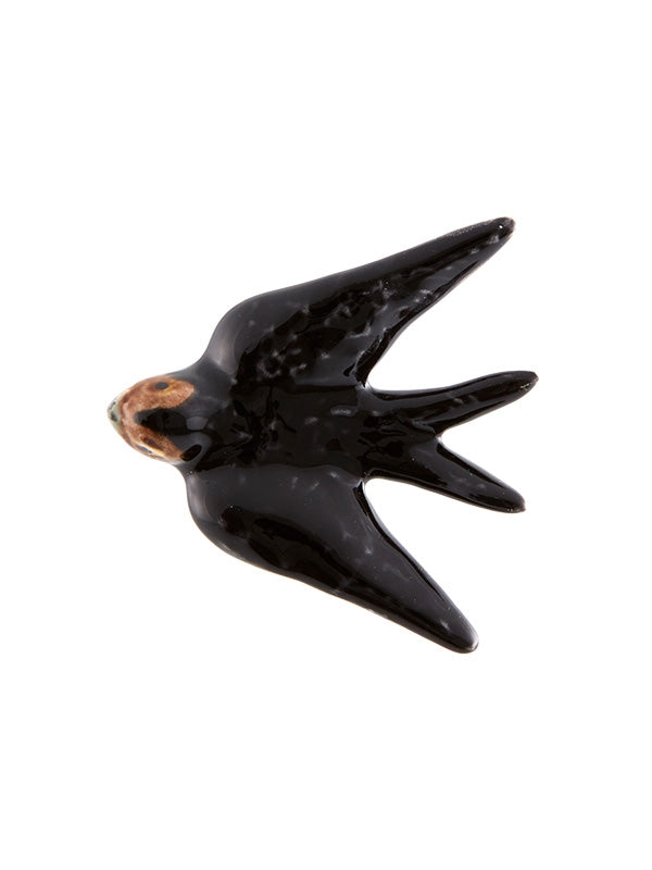 Figura de cerâmica preta representando uma andorinha