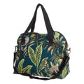 Bolsa tropical com estampado de folhas e macacos e alças pretas