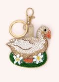 Porta-chaves em forma de cisne com contas e flores decorativas, argola e fecho dourados