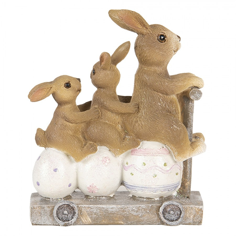 Decoração de coelhos em carrinho com ovos decorativos