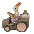 Figura decorativa de coelho a conduzir trator com pássaro
