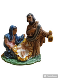 Figura de porcelana da Natividade com Maria, José e Menino Jesus em base verde