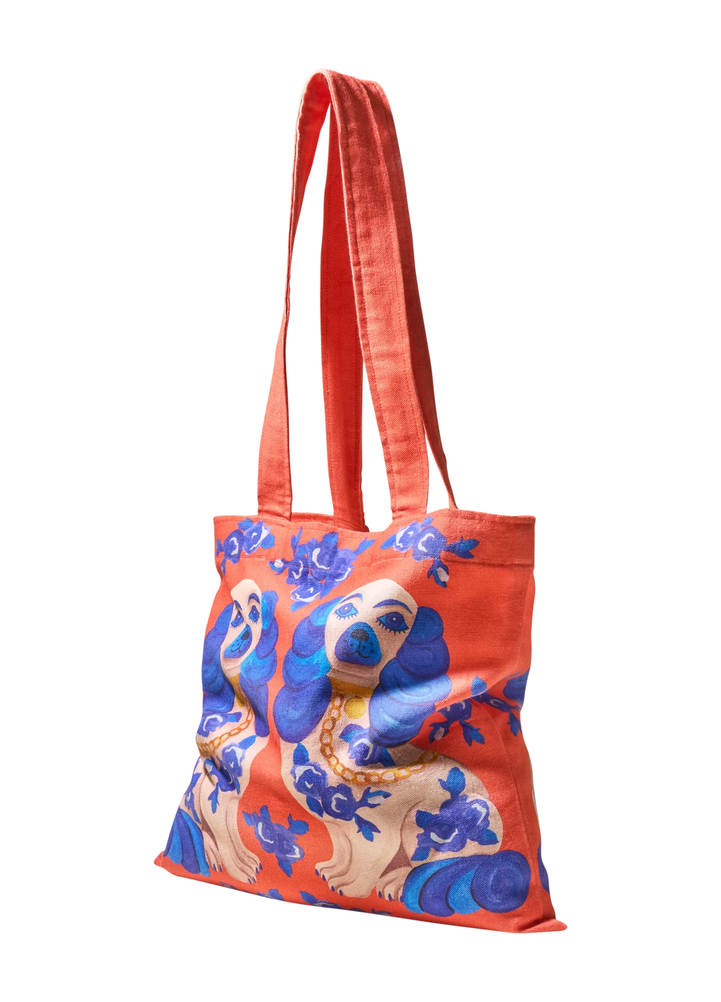Saco de tecido laranja com estampa de cães e flores azuis.