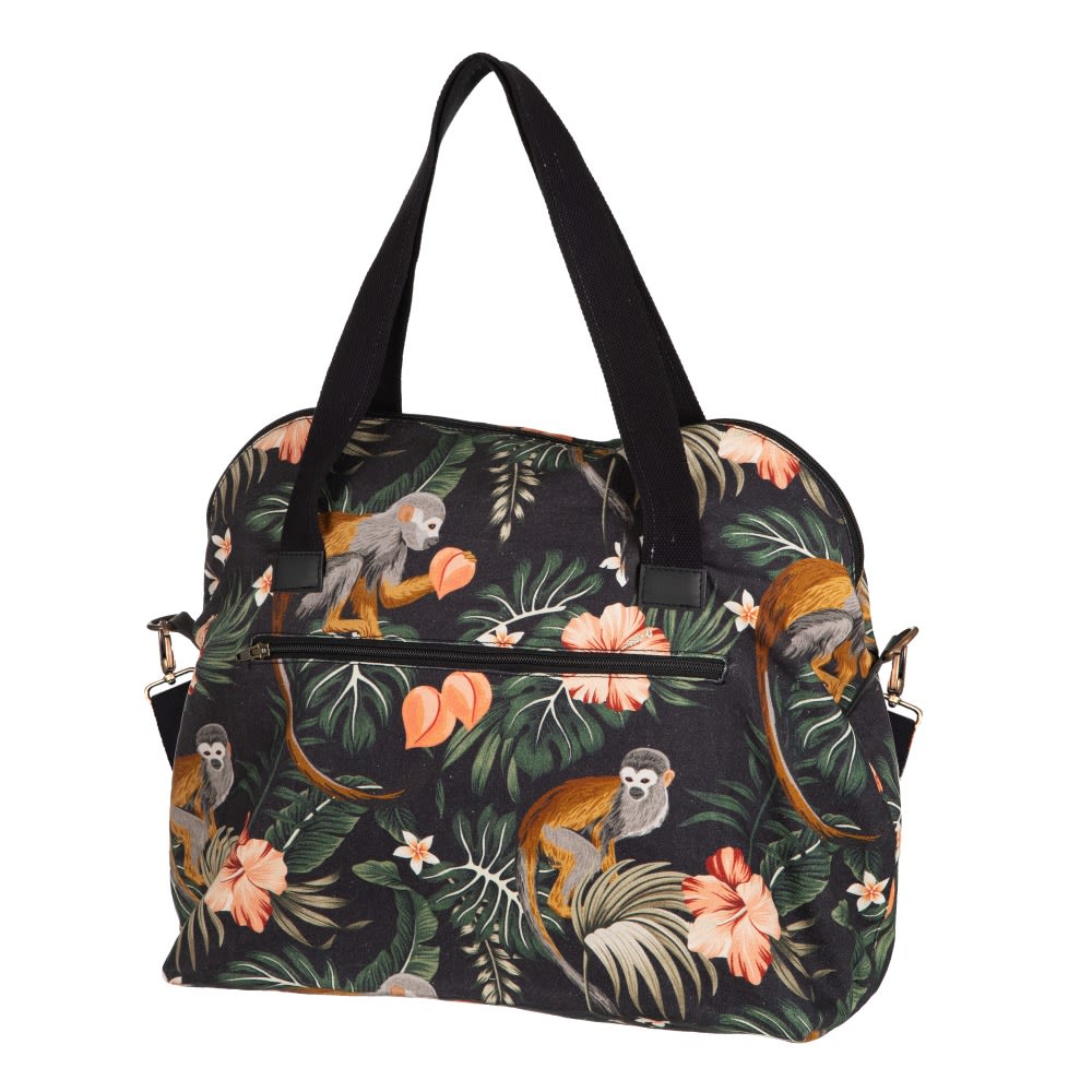 Mala com padrão de macacos e flores sobre fundo preto