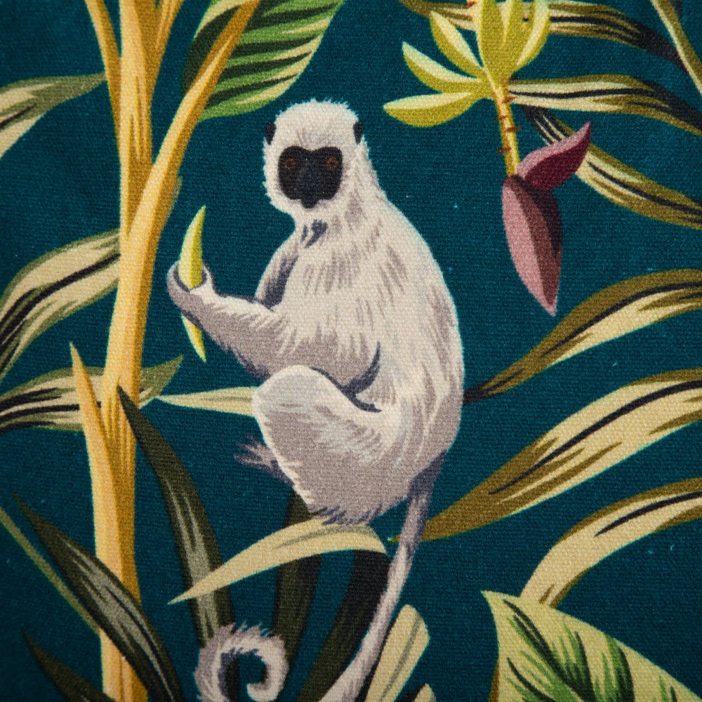 Tecido com padrão de lémure em folhas tropicais, fundo azul