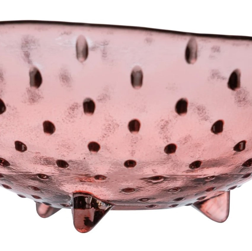 tigela rosa de vidro com textura e pequenas patas